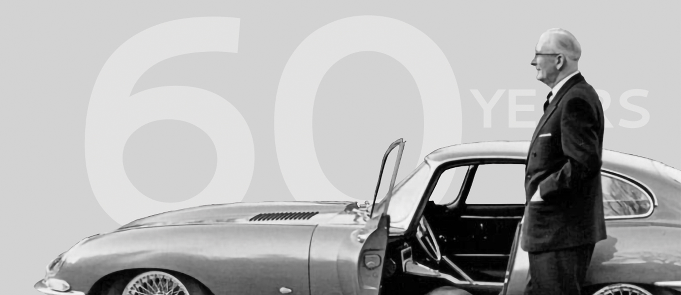 Jaguar E-Type 60th anniversary calendar cover featuring a classic car