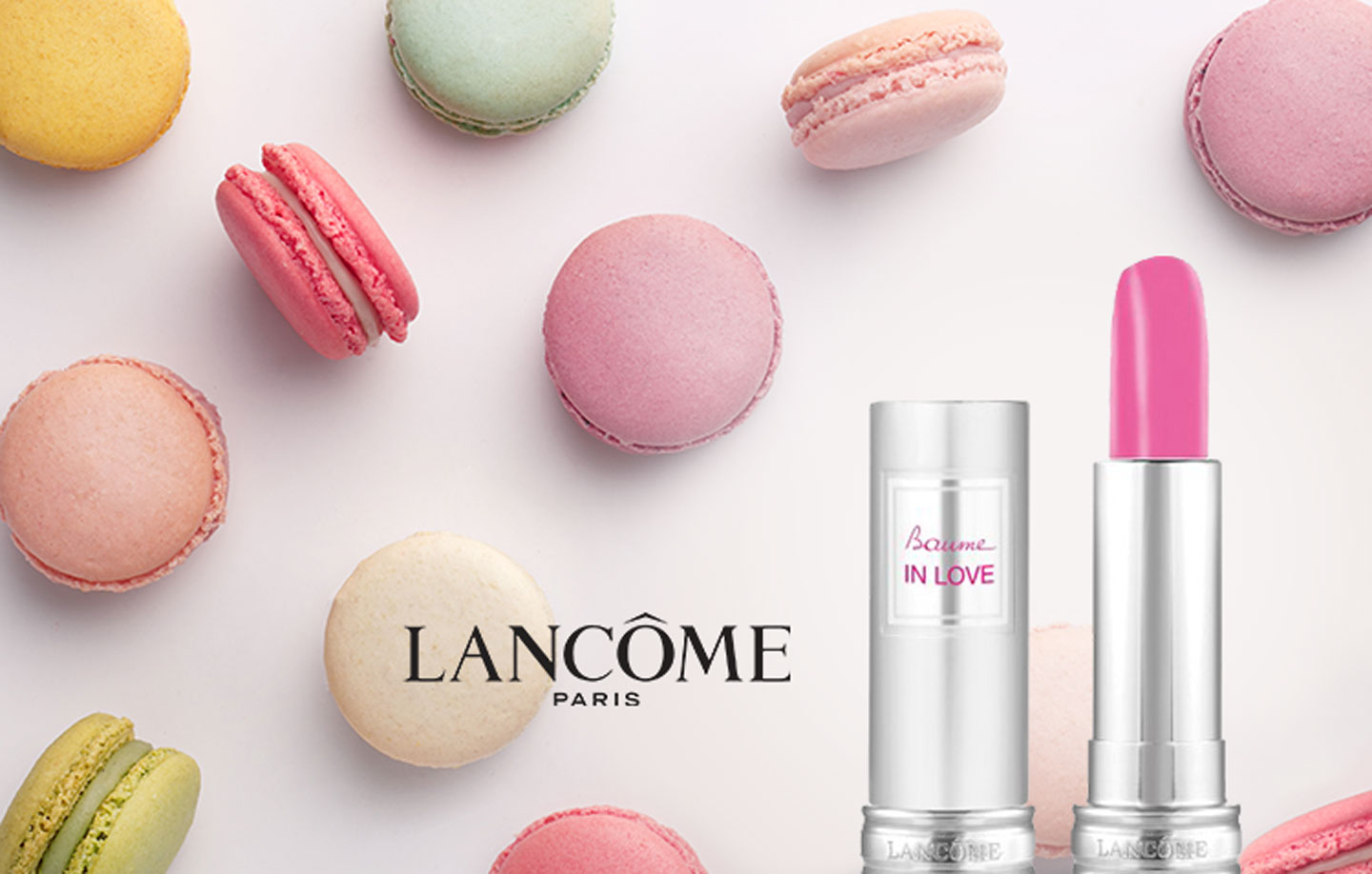 Lancôme beauty campaign compositions arranged on a dark background